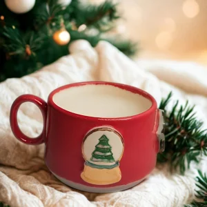 Snow Globe With Pine Trees And Red Porcelain Mug